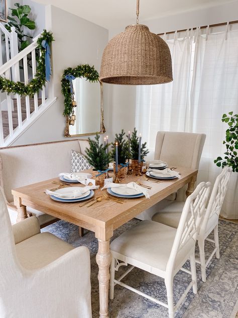 Simple Coastal Christmas tablescape - felt lucky enough to use to host Greg’s family for a early Christmas this year. This space has a few minor changes to it coming soon. #LTKHoliday Follow my shop @blossominginteriors on the @shop.LTK app to shop this post and get my exclusive app-only content! #liketkit #LTKhome #LTKSeasonal @shop.ltk https://liketk.it/3XllI Coastal Christmas Tablescapes, Coastal Grandmother Christmas, Christmas Tablescape, Coastal Christmas, Christmas Tablescapes, Fir Tree, Woven Basket, Blue Christmas, Tablescapes