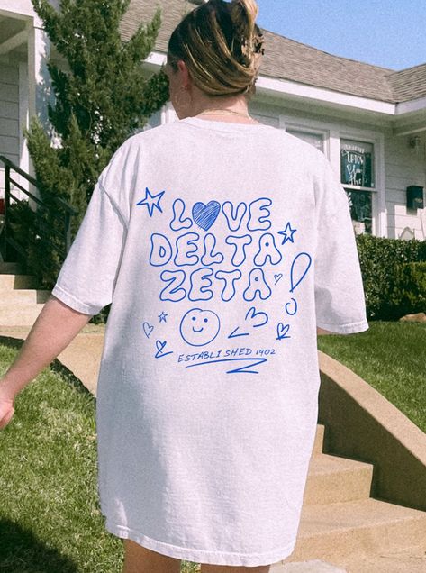 Soft, cute, and trendy, this Delta Zeta sorority t-shirt will quickly become your go-to cozy shirt! Use the drop down to specify preference between white, ivory, violet, island reef, chambray, orchid and blossom.LISTING IS FOR DELTA ZETA. Please be sure you are ordering for your correct Sorority.We print on high quality, soft, & heavyweight materials, sustainably made and printed in the US.♥ SIZING ♥Unisex Sizing-For a more feminine, fitted look we recommend getting your size.For a more oversize Alpha Xi Delta Shirt, Zeta Tau Alpha Shirts, Alpha Delta Pi Sorority, Alpha Phi Sorority, Alpha Epsilon Phi, Sorority Shirt Designs, Big Little Shirts, Delta Sorority, Alpha Sigma Tau