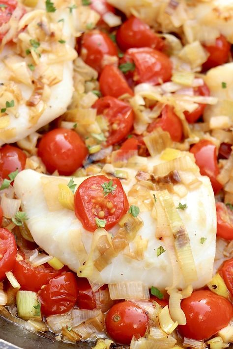 BRAISED COD with TOMATOES and LEEKS － Once the veggies are chopped, this one-pan fish dish cooks in 15 minutes and is loaded with flavor. Elegant enough for company yet simple enough for busy weeknights, it's also a delicious way to increase your intake of heart-healthy fish. Braised Cod, Cod With Tomatoes, Braised Leeks, Leek Recipes, Healthy Fish, One Pan Meals, The Fountain, Tomato Recipes, Chicken Pot