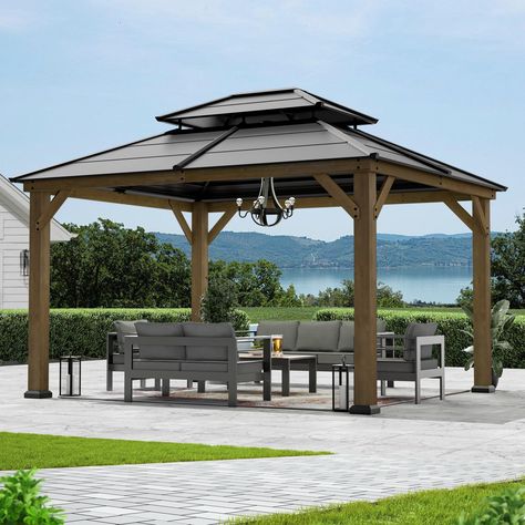 PRICES MAY VARY. [Galvanized Steel Double Top] The cedar framed hardtop gazebo features a double-tier roof design for optimal ventilation and airflow, offering resilience against strong winds and heavy rains. The galvanized steel roof is rust-resistant and can help block 90% UV rays. The powder coated metal roof deflects direct sunlight, providing shelter for your outdoor activities in any weather. [Premium Cedar Wood Materials] The Cedar Framed Wood Gazebo features a frame made from FSC Certifi Backyard Patio And Deck, Deck With Gazebo, Wood Gazebo, Steel Roof, Wooden Gazebo, Hardtop Gazebo, Outdoor Gazebos, Gazebo Pergola, Wooden Posts