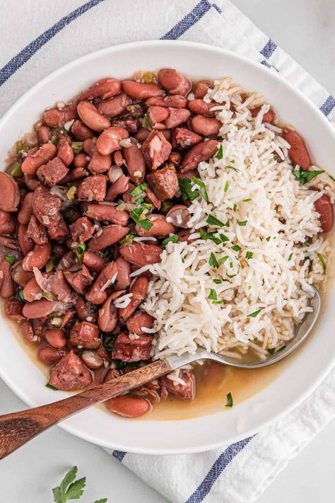 This BEST Red Beans and Rice Recipe is the Ultimate Cajun Favorite done right!  Insanely flavorful kidney beans with a hint of spice and meaty essence are served over white rice for the perfect Southern creole recipe.  Much better than Popeye's! #redbeans #kidneybeans #redbeansandrice #cajunrecipe Chicken And Kidney Beans, Creole Red Beans And Rice Recipe, Prepped Pantry, Best Red Beans And Rice, Beans And Rice Recipes, Mexican Beans And Rice, Rice Crockpot, Dry Beans Recipe, Red Beans Recipe