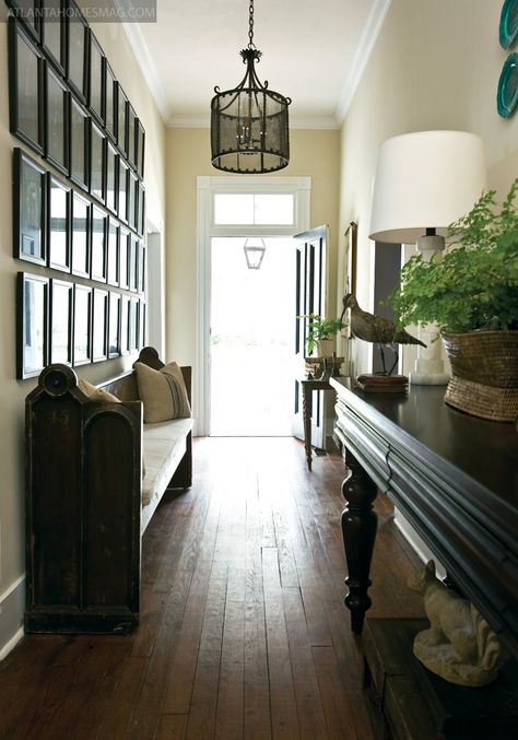 In Madison, a spacious hallway connects the home“s main rooms. Small Space Seating, Entrance Way, Church Pew, Entry Hallway, Atlanta Homes, Narrow Hallway, Up House, Entry Hall, Design Del Prodotto