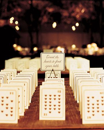 The number of hears on tented playing cards designates table assignments. The guests' names are on the other side. Creative Seating Cards, Funny Wedding Cards, Wedding Aesthetics, Funny Wedding Invitations, Lowcountry Wedding, Seating Cards, Funny Wedding, Wedding Tables, Martha Stewart Weddings