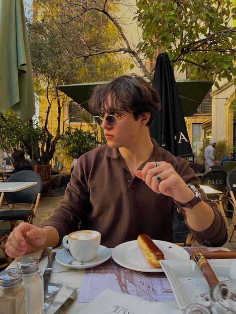 Coffee Shops Poses, Man Aesthetic Pose, Guy In Coffee Shop Aesthetic, Men Coffee Shop Photoshoot, Man At Restaurant Aesthetic, Mens Coffee Shop Outfit, Man Drinking Coffee Aesthetic, Aesthetic Posing Ideas Men, Pose In Cafe Shop