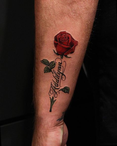 Hunter Schuon on Instagram: “Rose and some script from last night! Always enjoy tattooing flowers! To schedule a tattoo appointment please call or email…” Roses Around Name Tattoo, Red Roses Arm Tattoo, Red Rose Arm Tattoo, Tattoo Flower With Name, Red Rose Tattoo Men, Name With Rose Tattoo, Red Roses Tattoo, Rose Tattoo Men, Rose Stem Tattoo