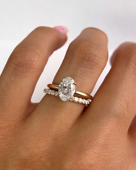 Nothing beats a classic stack! Our Aviva ring with an oval cut diamond paired with the Ellie band • #finejewelry #diamond #ovaldiamond #engagement #engagementring #weddingband #goldring #ringstack #ovalengagementring #classicengagementring #solitarering Oval Engagement Ring Stacked Bands, Wedding Band Stack Ideas Oval, Oval Wedding Ring Stack, Oval Ring Stack, Oval Engagement Ring Stack, Dimond Engagement Rings, Engagement Ring Stack, Stacked Engagement Ring, Oval Solitaire Engagement Ring