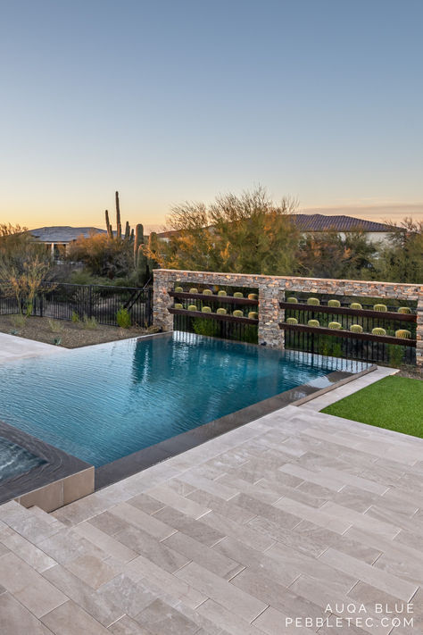 Add a cactus wall or desert plants around your pool to create a natural and beautiful warm-weather escape. Florida Pools, Desert Pool, Geometric Pools, Arizona Pools, Pool Landscape Ideas, Geometric Pool, Florida Pool, Pool Finishes, Pool Landscape