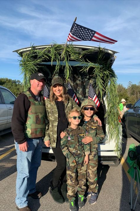 Family costume idea, army or military outfits where the whole family dresses in camouflage. Trunk or treat idea with the trunk decorated with greenery and American flags Army Trunk Or Treat Ideas, Lords Army Trunk Or Treat, Military Trunk Or Treat, Trunk Or Treat Hunting Theme, Army Trunk Or Treat, Hunting Trunk Or Treat Ideas, Homeade Halloween Costumes, Army Halloween Costumes, Usa School