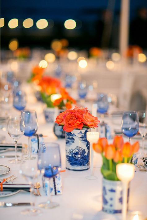 Navy And Orange Party Decor, Navy Blue And Orange Centerpieces, Blue White And Orange Tablescape, Colorful Confetti Wedding, Blue And Orange Tablescape, Dutch Themed Wedding, Dutch Wedding Theme, Orange Blue Wedding Theme, Delft Wedding Theme