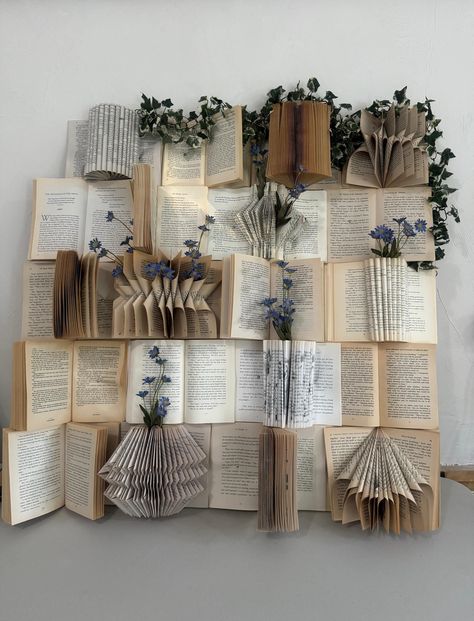 Old Book Wall Art, Book On Wall Decor, Fake Flower Bedroom Wall, Diy Book Wall Backdrop, Old Book Decorations, Literary Party Decorations, Book Feature Wall, Wall Decor With Book Pages, Gallery Wall Bookshelf