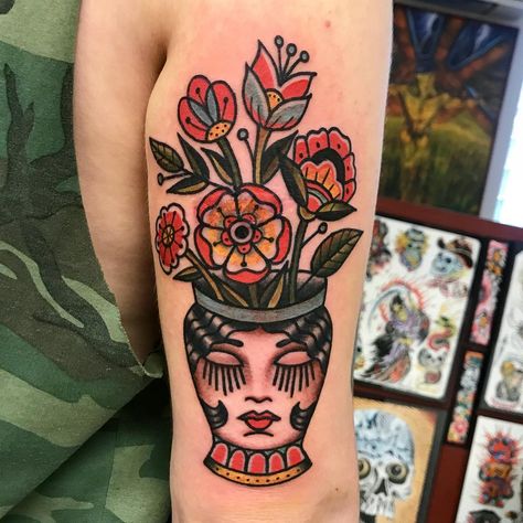 Face vase flowers tattoo Traditional Flower Vase Tattoo, American Traditional Vase Tattoo, Traditional Vase Tattoos, Flower Face Tattoo, Flower Pot Tattoo, Traditional Tattoo Vase, Traditional Tattoo Woman Face, Flower Vase Tattoo, Moms Tattoo