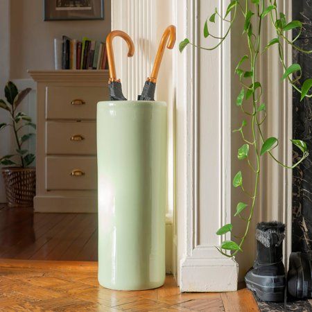 Cylindrical umbrella stand in traditional Chinese celadon glaze. Made of strong vitreous porcelain. Great waterproof storage for umbrellas, canes, and walking sticks. Alternatively use as a floor vase for dry plant or lucky bamboo displays. Color: Green. Tall Floor Vases, Celadon Glaze, Offset Patio Umbrella, Patio Umbrella Stand, Canes And Walking Sticks, Yellow Umbrella, Lucky Bamboo, Dry Plants, Porcelain Floor