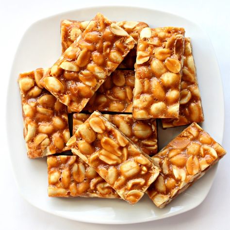 Butterscotch Peanut Bars are a sweet, chewy cookie bar that almost qualifies as candy. The buttery cookie base is crowned with salted peanuts coated in butterscotch. These shiny bars are great for party platters and cookie exchanges, as well as for filling care packages with tempting snacks.| themondaybox.com #cookies #peanuts #barcookies Peanut Butter Marshmallow Squares, Peanut Bars, Butter Bars Recipe, Peanut Butter Bars Recipe, Peanut Bar, Protein Rich Snacks, Peanut Candy, Candy Recipe, Butter Bars