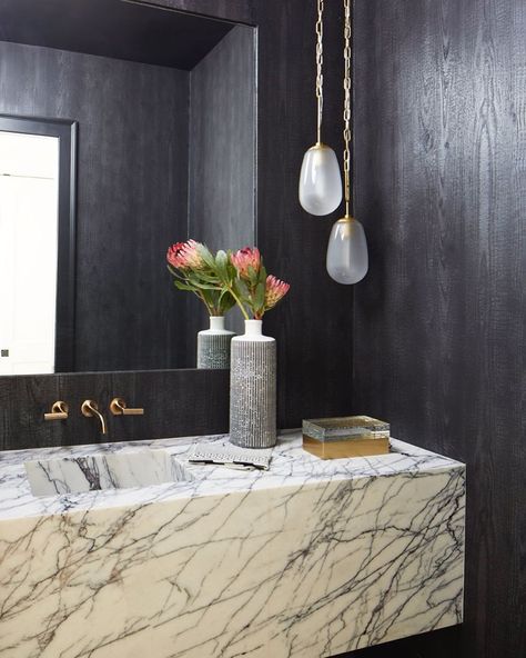 Emily Del Bello Interiors on Instagram: “Moody powder room • fun fact: the wallpaper is real hand land wood • designed by @emilydelbellointeriors . . . . . Photo: @mali_azima…” Floating Marble Vanity, Floating Marble Sink, Floating Sink Vanity, Moody Powder Room, Hunted Interior, Floating Sink, Gold Faucet, Marble Block, Marble Vanity