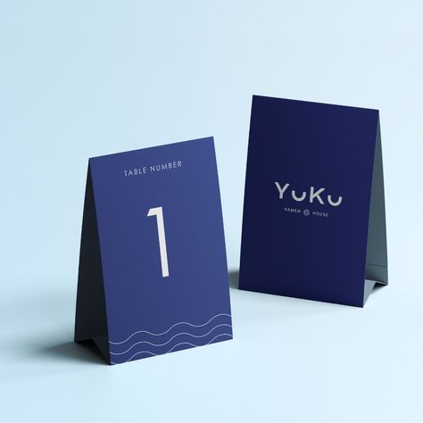 Brand Identity implemented onto a table number stand for the Japanese restaurant Yuku. Table Number Design, Restaurant Table Numbers, Japanese Ramen Restaurant, Table Number Stand, Ramen House, Table Number Stands, Ramen Restaurant, Restaurant Table, Number Design