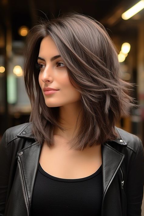 This low-maintenance medium length haircut offers the perfect balance of style and easeWith its choppy layersit adds texture and volumemaking it ideal