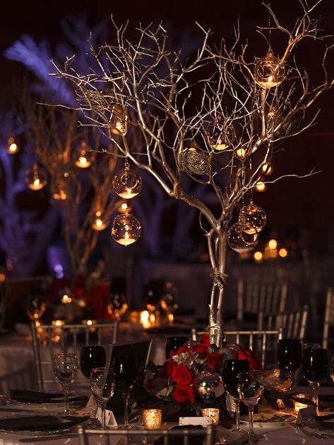 49 Winter Wedding Centerpieces That Celebrate the Season Tree Centrepiece Wedding, Floating Tea Candles, Winter Wonderland Wedding Centerpieces, Labyrinth Wedding, Tree Centrepiece, Mercury Glass Centerpiece, Tree Branch Centerpieces, Centrepiece Wedding, Christmas Wedding Centerpieces