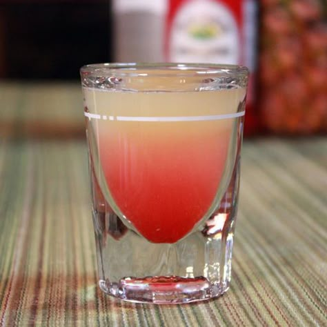 The Pineapple Upside-Down Cake Shot is a fun vodka-based shooter that, while not the most sophisticated drink in the world, is a popular one for parties and nightclubs. It’s a semi-layered shot, with bright-red grenadine at the bottom and pineapple juice … Pineapple Upside Down Cake Shot Recipe, Pineapple Upside Down Cake Shot, Shots Alcohol Recipes, Cake Shot, Strawberry Banana Milkshake, Cake Shots, Shots Alcohol, Vodka Shots, Liquor Drinks