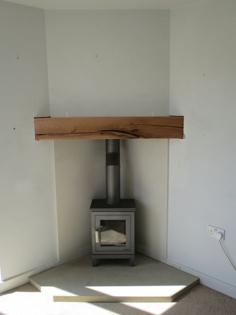 Wood Stove In Living Room Corner, Wood Burner Fireplace Corner, Stove Fireplace Ideas Corner, Log Burner Extension, Wood Stove Set In Fireplace, Corner Stove Fireplace Ideas, Tv Over Wood Burning Stove, Wood Burner In Kitchen, Corner Log Burner Living Rooms