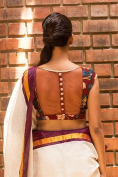 We are so tripping on details this season! Check out another cool number in a maroon kalamkari fabric having a sheer net back with shimmer button detailing. This would be a lovely and versatile kalamkari addition to any wardrobe.Endless pairing options abound…pair with any saree or skirt having maroon in it. Or just pair with a plain saree in any of the blouse colors and be easy breezy. #kalamkari #saree #india #blouse #houseofblouse Pack Blouse Design, Modest Blouse Designs, Banaras Lehenga, Boy Kurta, Modest Blouse, French Curve, Kalamkari Fabric, House Of Blouse, Kalamkari Blouse