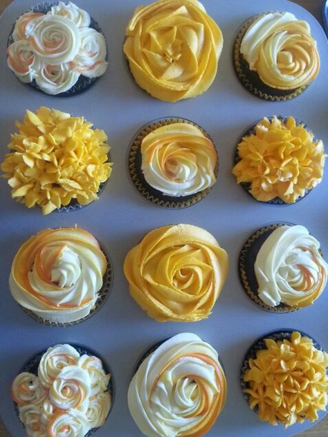 Yellow, orange and white cupcake garden.  Cupcake Roses: hershey's chocolate recipe with vanilla buttercream icing Yellow Frosting Cupcakes, Orange And Yellow Cupcakes, Yellow Frosted Cupcakes, Orange And White Cupcakes, Red And Yellow Cupcakes, Yellow Cupcakes Decoration, Cupcake Roses, 45 Anniversary, 60th Birthday Cupcakes