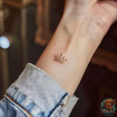 Unveiling the Symbolism: Exploring the Intricate Meanings of a Queen’s Crown Tattoo: 118 Designs - inktat2.com Dainty Tiara Tattoo, Queen Wrist Tattoo, Mini Crown Tattoo, Little Crown Tattoo, Flower Crown Tattoo, Crown Tattoo On Wrist, Princess Crown Tattoo, Princess Crown Tattoos, Poem Tattoo