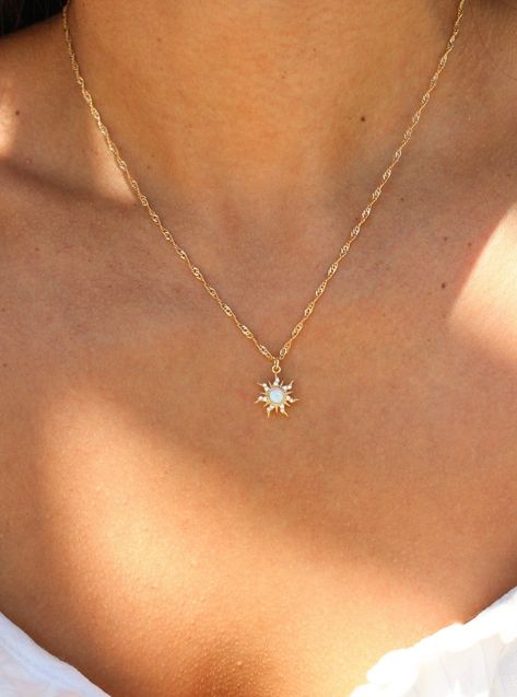 Embrace your inner princess with our Cassie Necklace. She features a gold filled chain, which makes it an elegant everyday necklace. Its dainty opal sun charm easily adds a pop of color to any outfit, ensuring you always stand out. This shiny piece is perfect for necklace layering or equally beautiful worn alone. Best of all, this necklace is tarnish free ! • Single Gold filled chain (of choice) with charm• Gold Filled• Bead Chain Length: 20"• Twist Chain Length: 16" + 1" extender (to make adjus Necklace Dainty Gold, Jewelry Gold Dainty, Single Charm Necklace, Casual Gold Jewelry, Small Dainty Jewelry, Dainty Necklaces Gold, Dainty Sun Necklace, Gold Jewelry Hoco, Simple Cute Jewelry