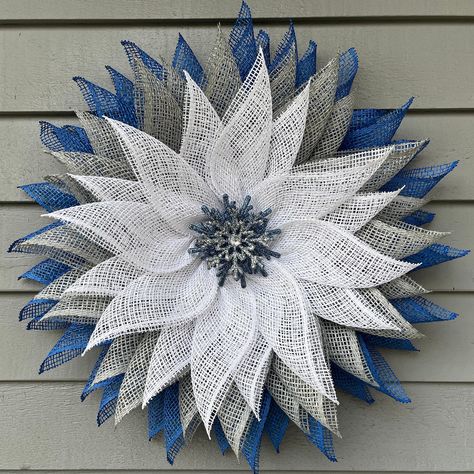 This lovely snowflake-themed flower wreath is a great way to decorate all winter, especially after the holidays end!  Its white, gray, and royal blue petals are made from poly burlap mesh. The flower's centerpiece is a silver and blue glittery snowflake. Measurements are approximately 21" in diameter and 4" in depth so this should fit well behind a storm door.   All of my wreaths are handcrafted, one-of-a-kind designs and I use high quality materials. Each comes with a felt backing to protect yo Winter Flower Wreath, Winter Mesh Wreath, Mesh Flower Wreath, Burlap Wreaths For Front Door, Blue Flower Wreath, Canvas Photos, Wreath Mesh, Deco Mesh Wreaths Diy, Snowflake Wreath