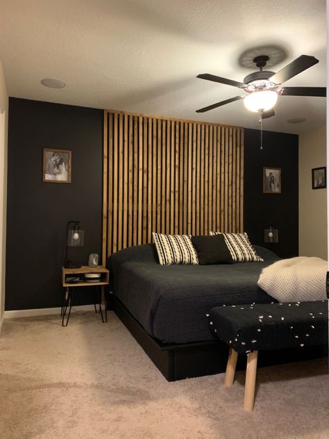 Accent Slat Wall Bedroom, Slatted Wooden Headboard, Bedroom Panelling Slats, Black Wall With Wood Accents Bedroom, Black Wood Slat Wall Bedroom, Black And Wood Slat Wall, Bed Focal Wall, Modern Slat Wall Bedroom, Paneled Headboard Wall