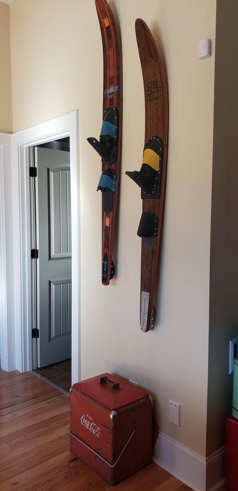 Hanging water sports equipment gives an interesting vibe to a lake house basement. Ski Hanging Ideas, Vintage Water Ski Decor, Waterski Decor Ideas, Water Ski Decor Ideas, Water Ski Decor, Lake House Basement, Nautical Home Decorating, Vintage Cooler, House Basement