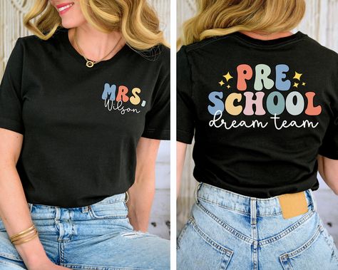 You will have the most stylish teacher team in the school with these shirts! This is also a great gift for a new teacher.  Leave the name you would like in the box provided SIZE UP 1-2 SIZES FOR THAT OVERSIZED LOOK   Thanks so much for shopping with me! Please message me with any questions you may have! I am always available to help :) Also, I would love to feature you on our insta if you want to tag me @poppyroseclothing    PRODUCTION TIME: 1-3 business days    SHIPPING TIME: 2-5 business days   PRODUCT DESCRIPTION: Bella Canvas Unisex T-shirt Super soft cotton and excellent quality print makes. 100% Soft cotton (fibre content may vary for different colors) Light fabric (4.2 oz/yd² (142 g/m Runs true to size CARE INSTRUCTION: Machine wash: cold,  Tumble dry: low heat, do not iron directly Preschool Svg Teacher, Prek Teacher Shirt, Tshirt Teacher Outfits, Teacher Name Shirt, Preschool T Shirts For Teachers, Preschool Shirt Ideas, Preschool Teacher Tshirts, Preschool Teacher Tshirt Ideas, Prek Teacher Shirts Designs