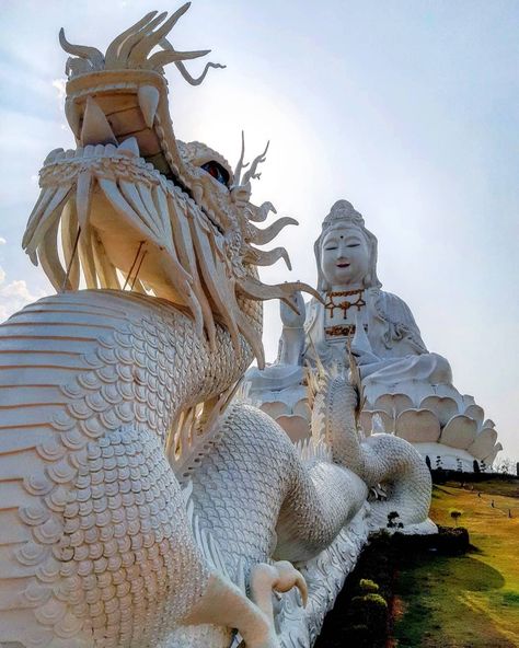 Wat Huay Pla Kung (or Wat Huai Pla Kang) is one of the most beautiful places visited in Thailand. Like most of the temples in Chiang Rai it is quite recent, in fact the construction of the temple was completed in 2001. The complex consists of 3 buildings: the large statue of the goddess of compassion Guan Yin (the one you can see in this photo), the little white temple and the 9-tier Chinese pagoda | Take A View | #takeaview #chiangrai #thailand #wathuayplakung #wat Goddess Of Compassion, Chinese Pagoda, Chiang Rai Thailand, White Temple, Guan Yin, Chiang Rai, The Goddess, Chiang Mai, The Temple