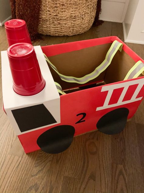 Fire Truck Box Costume, Fire Truck Box Diy, How To Make A Fire Truck From Cardboard, Fire Truck Diy Cardboard Boxes, Diy Firetruck Costume, Firetruck Halloween Costume, Diy Fireman Costume Kids, Diy Fire Truck Costume, Fire Truck Costume Diy