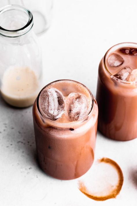 This recipe turns a few simple ingredients into a delicate cold chocolate drink. Iced chocolate is easy to make with all the boosting flavors of a warm chocolate drink in a cold drink. Easy, delicious, and vegan. www.thegreencreator.com - #thegreencreator #vegan #plantbased #icedchocolate #veganchocolatemilk #chocolatemilk #chocolademelk #coldchocolatemilk #veganchocolate #iceddrink Iced Chocolate Drink Recipe, Iced Cacao Drink, Ice Chocolate Drink Recipe, Ice Chocolate Drink, Cacao Powder Recipe, Iced Hot Chocolate, Cold Chocolate, Iced Chocolate, Cold Drinks Recipes