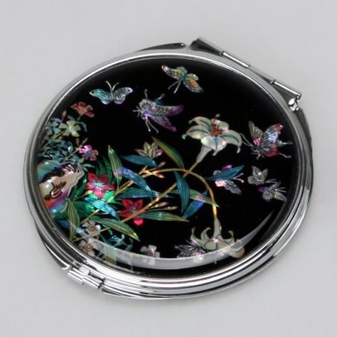 Mother of Pearl Lily Design Black Compact Cosmetic Double Makeup Pocket Round Mirror in Black, http://www.amazon.ca/dp/B00A654FIC/ref=cm_sw_r_pi_awd_xShzsb0Y0ZKYF Animated Paintings, Lily Flower Design, Lily Design, Compact Makeup, Antique Fans, Round Purse, Arabesque Pattern, Lipstick Case, Black Makeup