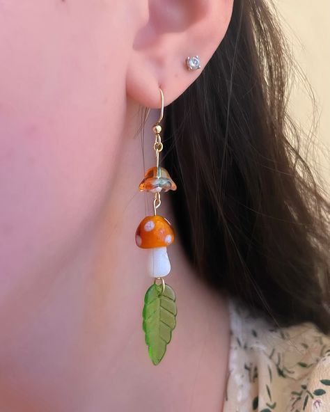 Cottagecore mushroom earrings🍄🍄‍🟫🌸🍃 these dangle earrings are brand new to the shop!! I’ve been wearing mine daily since creating this design and I can’t get enough🙌🏼 shop link in bio to get yours 🔗 Elements Jewelry, Cottagecore Mushroom, Mushroom Jewelry, Mushroom Earrings, Earrings Ear, Ear Cuffs, May 13, Beads Jewelry, Flower Earrings