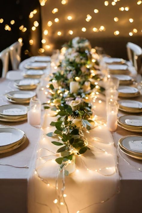 Dining table with fairy light runner Fairy Light Table Decorations, Light Table Centerpieces, Christmas Light Wedding Decor, Wedding Centerpieces Without Candles, Fairy Light Wedding Table Decor, Simple Wedding Centerpieces Fairy Lights, Table Lights Wedding, Fairy Lights Wedding Reception Table, Led Candle Wedding Centerpieces