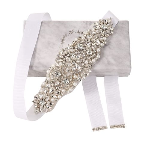 PRICES MAY VARY. Floral Rhinestone Belt: The handmade embellished bridal belt in silver is adorned with flower-shaped clusters of crystals. 100"L, 6"L embellishment: The length of the embellishment is 6.69 inches with a max width of about 2 inches at the widest point. The design tapers towards the edges and finished with white ribbed tie on either ends. The total length of the wedding dress belts with rhinestones is 3 yards. Acrylic: The embellished clear rhinestone and crystals are made of envi Beads Wedding Dress, Plain Wedding Dress, Dress Belts, Bridal Sash Belt, Wedding Dress Belt, Wedding Sash Belt, Rose Gold Crystal, Wedding Sash, Rhinestone Belt