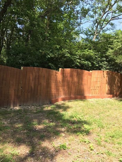 gaps at the bottom of wood privacy fence Gap Under Fence Ideas, Gaps Under Fence Ideas, Fence Gap Filler Ideas, Landscape Stones, Monkey Grass, Home Depot Paint, Diy Privacy Fence, Wood Privacy Fence, Fences Ideas