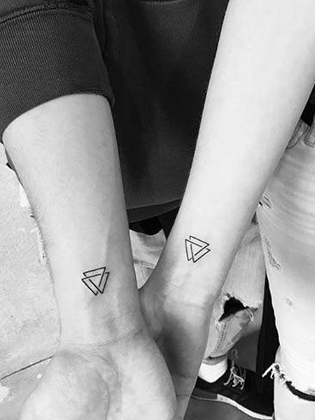 25 Intricate Geometric Tattoos for Women in 2020 - The Trend Spotter Triangle Infinity Tattoo, 2 Triangle Tattoo Meaning, Triangle Tattoo Placement For Women, 2 Triangle Tattoo, Small Unique Friendship Tattoos, Triangle Tattoo Family, Triangle Family Tattoo Ideas, Triangle Water Tattoo, Sibling Triangle Tattoo