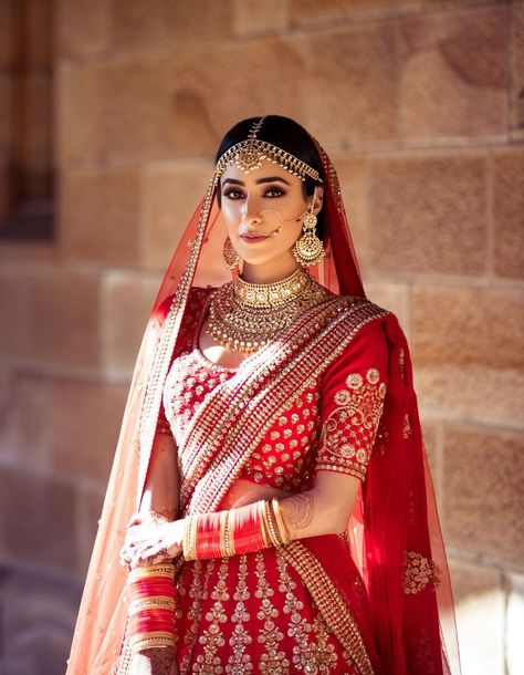 Photo of A bride dressed in a red Sabyasachi lehenga on her wedding day शादी की तस्वीरें, Indian Wedding Bride, Vibrant Outfits, Indian Bridal Photos, Perhiasan India, Wedding Lehenga Designs, Indian Bride Outfits, Bridal Lehenga Collection, Indian Wedding Photography Poses