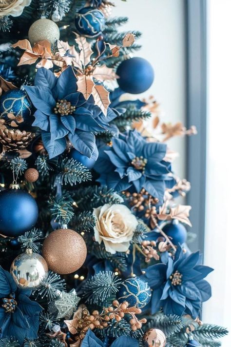 Blue Christmas Tree Ideas for a Unique Holiday Blue Teal Christmas Tree, Dark Blue And Red Christmas Tree, Slate Blue Christmas Tree, Winter Tree Ideas, Blue Copper Christmas Decor, Navy Blue And Gold Christmas Tree Ideas, Shades Of Blue Christmas Decor, Champagne And Blue Christmas Tree, Christmas Trees With Blue Decorations