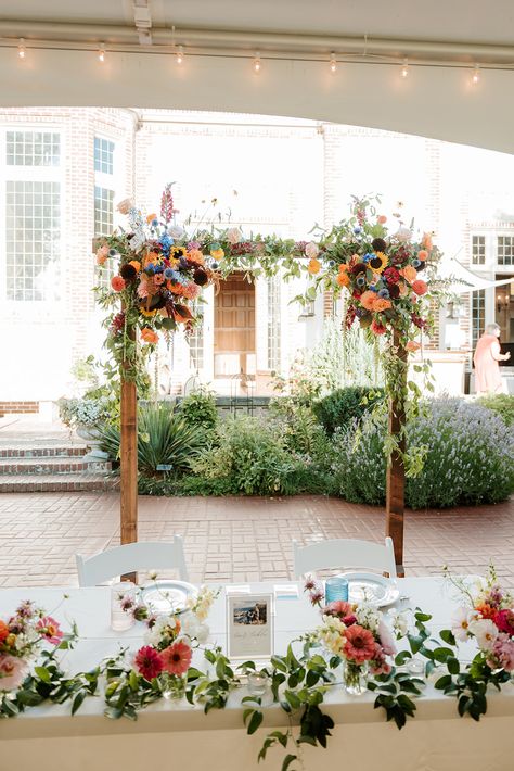 Wildflower Ceremony Decor, Wild Flower Wedding Arbor, Sweetheart Table With Bud Vases, Simple Wildflower Wedding Arch, Sweetheart Table Wedding Wildflower, Wildflower Head Table, Wedding Ceremony Flower Arch, Sweetheart Table Wildflowers, Wild Flower Ceremony