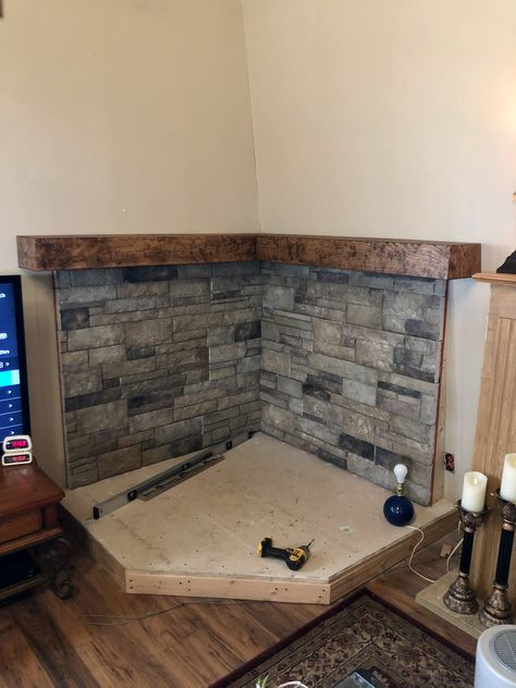 Stone Surround Wood Stove, Diy Corner Hearth Pad, River Rock Behind Woodstove, Tv And Wood Stove Layout, Wood Stove Mantle Corner, Wood Stove With Curved Pipe, Wood Burning Stove Basement, Wood Burner Stove Ideas, Rock Wall Behind Wood Stove