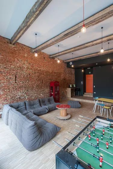 Garage Game Room Ideas and Inspiration | Hunker Youth Group Rooms, Garage Game Rooms, Entertainment Room Design, Basement Games, Hostels Design, Fun Room, Hangout Room, Game Room Basement, Game Room Family