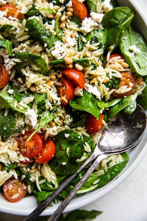 This colorful, hearty spinach orzo salad tastes like a garden at its summertime best—juicy tomatoes, fragrant basil, garlic and plenty of sunshine-y lemon. Spinach Orzo Salad Feta, Salad With Orzo, Orzo Salad With Spinach, Lemon Basil Orzo Salad, Orzo Salad With Feta, Orzo Spinach Salad, Spinach Salads, Basil Salad, Orzo Feta Salad