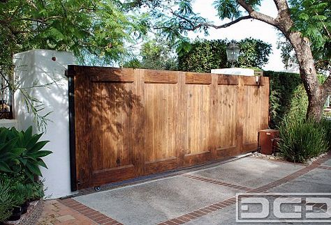 LA's Quality Custom Spanish Style Automatic Driveway Gate Manufacturer | Dynamic Garage Door Projects Spanish Garage, Wood Gates Driveway, Automatic Gates Driveways, Door Projects, Fence Stain, Gate Ideas, Wood Gate, Front Yard Fence, Spanish Style Home