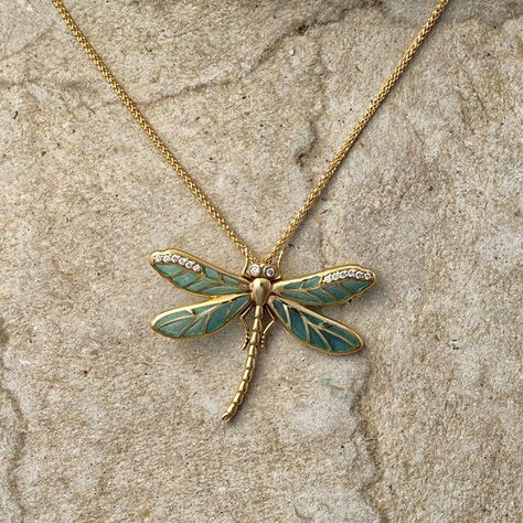 The embodiment of luxury this dragonfly pendant is fashioned from the finest 18ct yellow gold and embellished with sparkling diamonds. The blue wings are vitreous enamelled in the plique-à-jour style. Plique-à-jour is a highly specialised enamelling technique and provides vibrant colour to the design. Working like a miniature version of stained-glass, powdered glass is placed in cells and heated, which allows the light to shine through the transparent or translucent enamel. Completed with an 18i Dragon Fly Pendant, Dragonfly Jewelry Necklace, Dragonfly Clothing, Cute Pendants, Dragonfly Jewelry, Blue Wings, Dragonfly Necklace, Insect Jewelry, Dragonfly Pendant