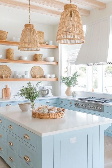 Discover the charm of the latest kitchen design with this serene coastal chic kitchen. Bright blue cabinets, wicker accents, and open shelving create a light, airy space perfect for cooking and entertaining. #kitchendesign #homedecor #coastalliving Boho Bright Kitchen, Light Blue Bottom Cabinets White Top, Coastal Kitchen Appliances, California Coastal Interior Design Kitchen, Grandmillenial Style Kitchens, Coastal Farmhouse Kitchen Design, Grand Millennial Style Kitchen, Coastal Boho Kitchen Ideas, Coastal House Kitchen