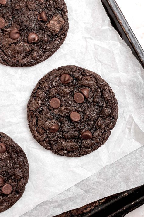 Indulge in these deliciously rich and decadent double chocolate chip cookies. These cookies are made without eggs so they're perfect for anyone with dietary restrictions too! These cookies are packed with gooey chocolate chips and lots of cocoa powder. Get the recipe here! Chocolate Chip Cookies Egg Free, Eggless Double Chocolate Chip Cookies, Chocolate Chip Cookies No Eggs Recipes, Baked Goods Without Eggs, Eggless Baked Goods, Chocolate Cookies Eggless, Chocolate Cookies Without Eggs, Easy Desserts Without Eggs, Cookie Recipes No Eggs